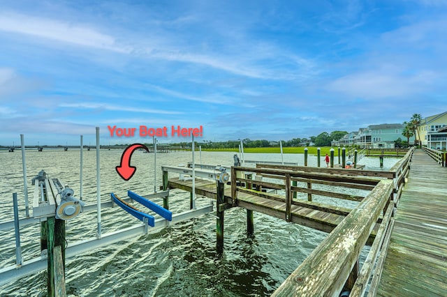 view of dock with boat lift