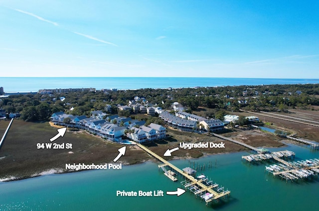 birds eye view of property with a water view