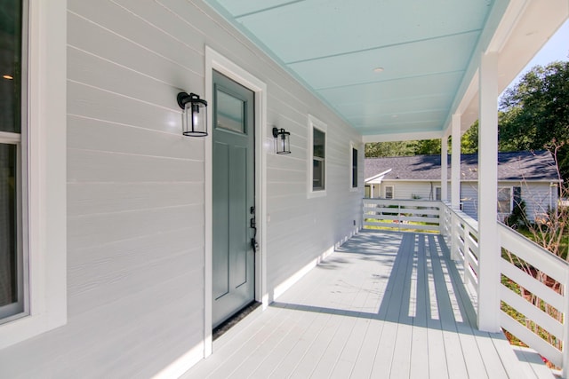 wooden deck featuring covered porch