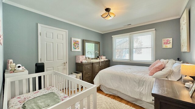 2636 Elissa Dr, Charleston, SC 29414 - bedroom with wood finished floors and crown molding