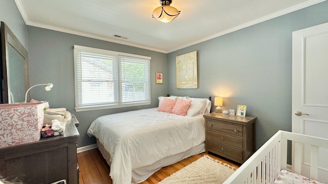 2636 Elissa Dr, Charleston, SC 29414 - bedroom with crown molding, wood finished floors, and baseboards