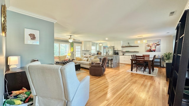 2636 Elissa Dr, Charleston, SC 29414 - living area featuring light wood-style floors, a ceiling fan, and crown molding