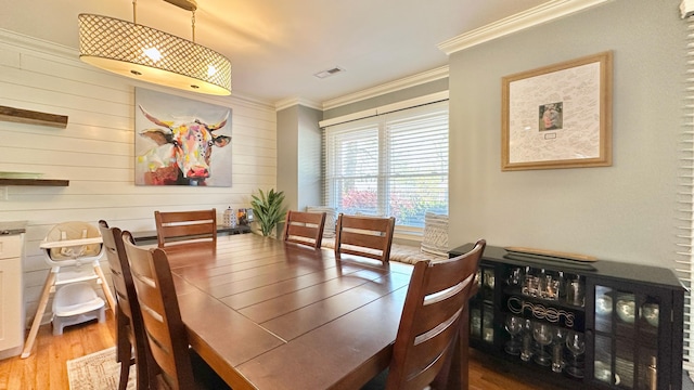 2636 Elissa Dr, Charleston, SC 29414 - dining room with crown molding, light wood-type flooring, and wood walls