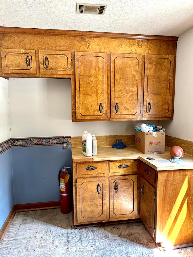 kitchen featuring a textured ceiling