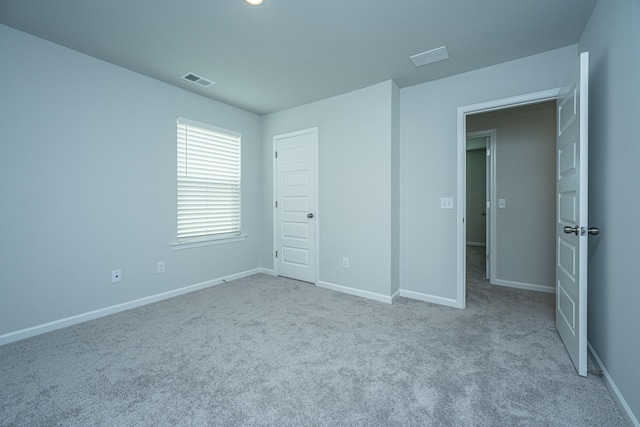 unfurnished bedroom featuring carpet