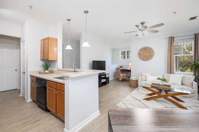 kitchen with visible vents, open floor plan, a sink, light wood-type flooring, and dishwasher