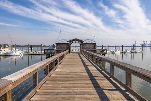 view of dock with a gazebo and a water view