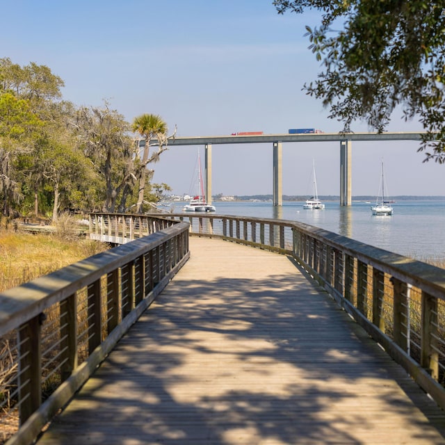 view of dock with a pier and a water view