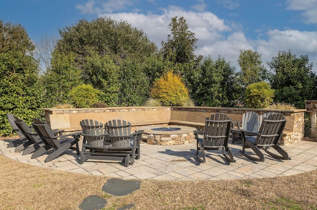 view of patio / terrace featuring a fire pit