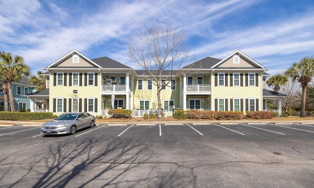 view of property featuring uncovered parking