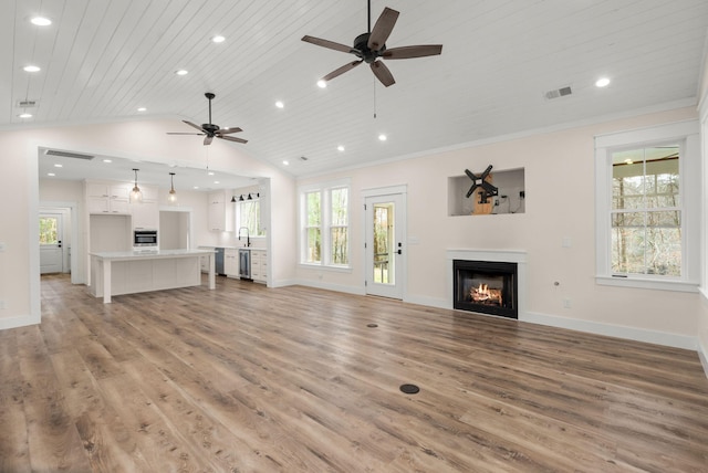 unfurnished living room featuring a warm lit fireplace, wood ceiling, vaulted ceiling, and light wood-style floors