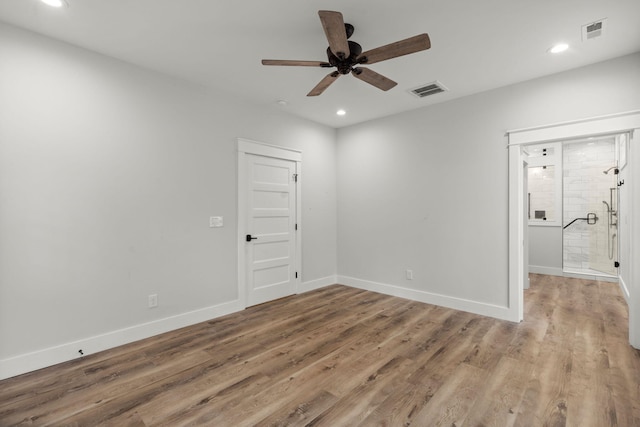spare room with recessed lighting, visible vents, baseboards, and wood finished floors