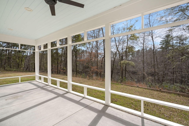 unfurnished sunroom featuring plenty of natural light and ceiling fan