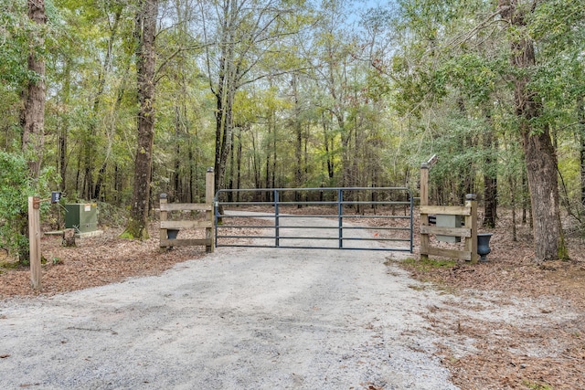 view of gate with fence