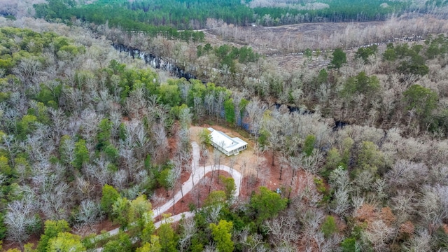 birds eye view of property with a wooded view