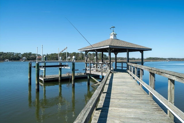 view of dock with a water view and a gazebo