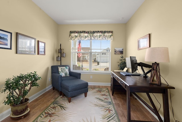 home office with wood finished floors and baseboards