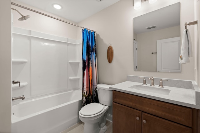 bathroom with toilet, vanity, shower / bath combo with shower curtain, and visible vents