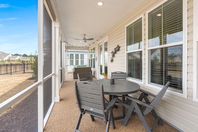 sunroom with a ceiling fan