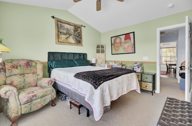 bedroom with lofted ceiling, carpet floors, and a ceiling fan