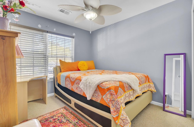 bedroom featuring visible vents, baseboards, and carpet