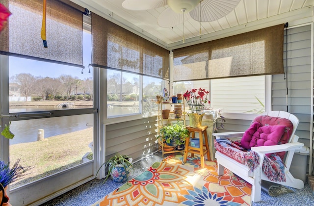 sunroom with a ceiling fan