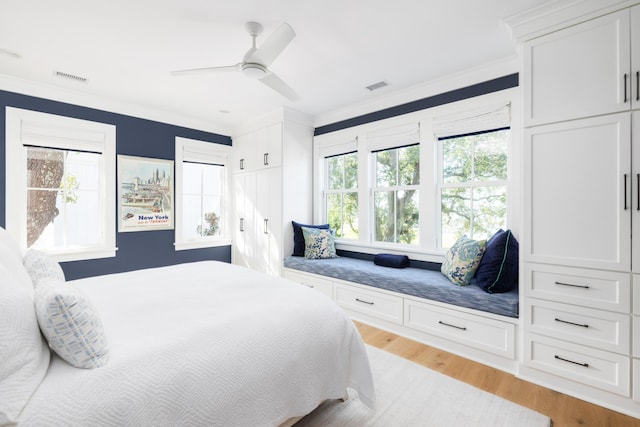 202 Bank St, Mount Pleasant, SC 29464 - bedroom featuring ornamental molding, light wood-type flooring, and ceiling fan