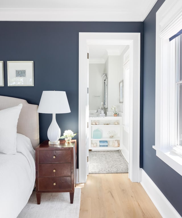 202 Bank St, Mount Pleasant, SC 29464 - bedroom with wood finished floors, ornamental molding, baseboards, and connected bathroom