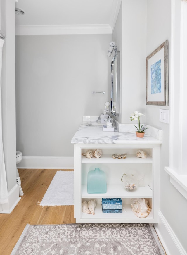 202 Bank St, Mount Pleasant, SC 29464 - bathroom featuring toilet, ornamental molding, vanity, wood finished floors, and baseboards
