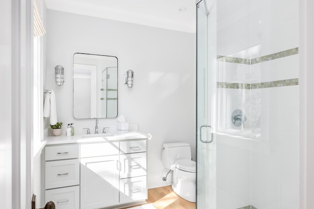 202 Bank St, Mount Pleasant, SC 29464 - full bath featuring toilet, a stall shower, vanity, wood finished floors, and baseboards