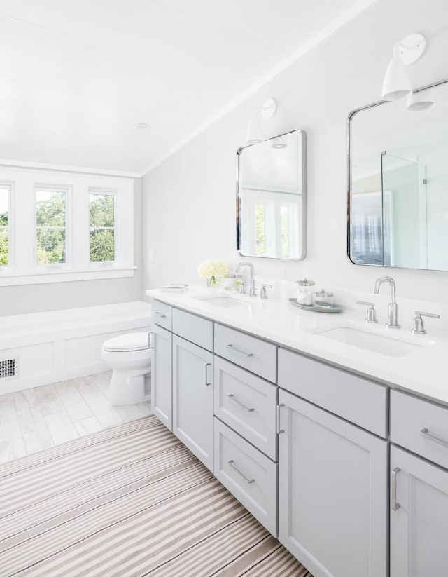 202 Bank St, Mount Pleasant, SC 29464 - full bathroom featuring double vanity, toilet, and a bath