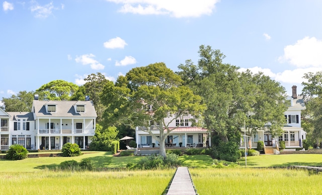 202 Bank St, Mount Pleasant, SC 29464 - back of house featuring a chimney and a yard