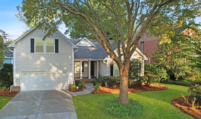 front facade featuring a front yard and a garage