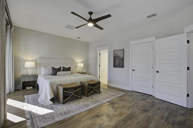 bedroom with ceiling fan and dark hardwood / wood-style flooring