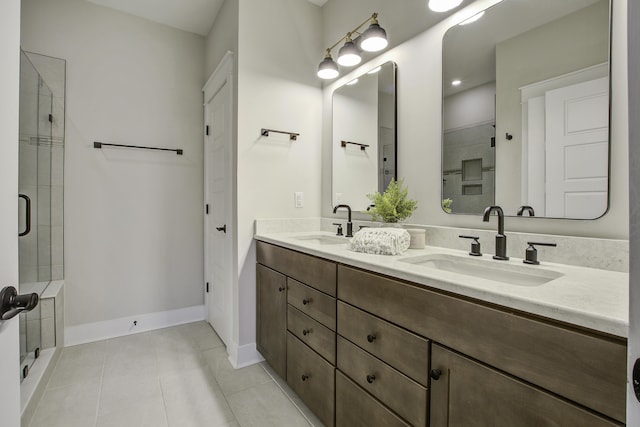 bathroom with tile patterned flooring, an enclosed shower, and vanity