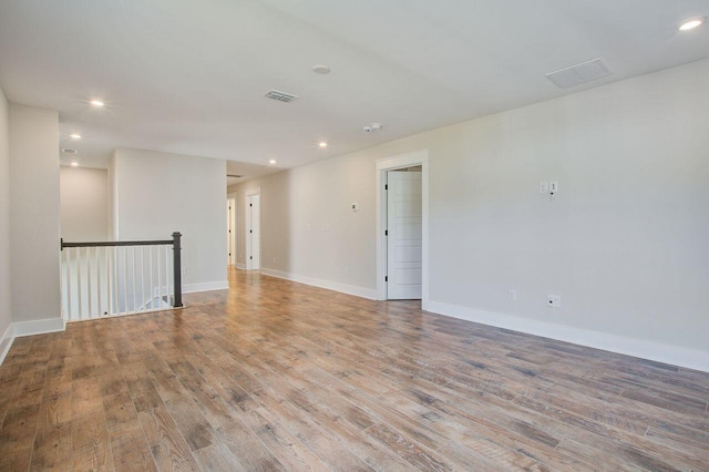 spare room with light hardwood / wood-style floors