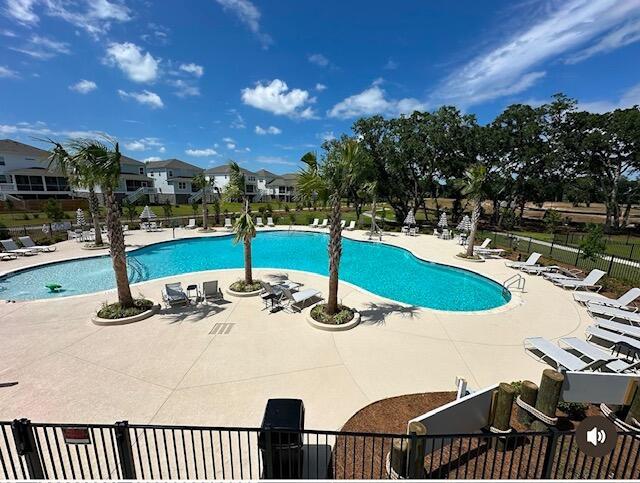 view of swimming pool with a patio area