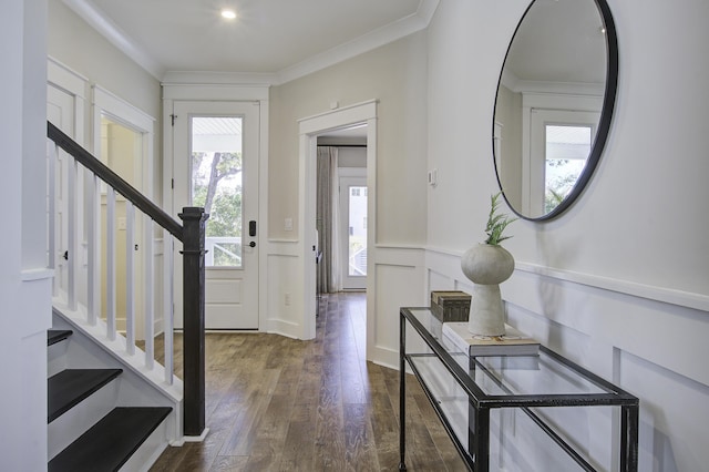 entryway with dark wood-type flooring and crown molding