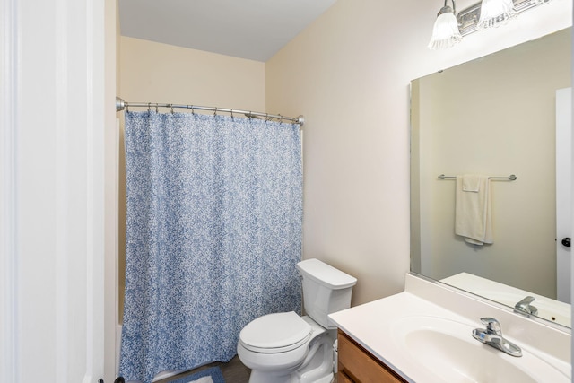 full bath with vanity and toilet