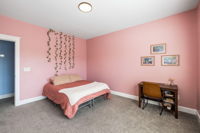 carpeted bedroom featuring baseboards