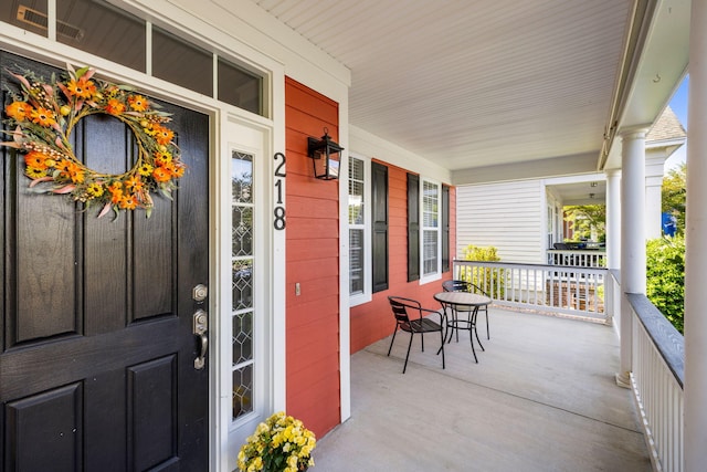 entrance to property featuring a porch