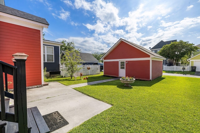 view of yard featuring fence and a patio