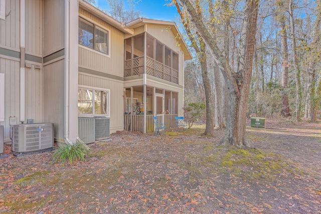 back of house featuring central AC unit