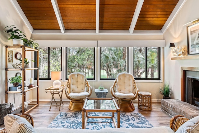 living room with hardwood / wood-style floors, plenty of natural light, and a fireplace