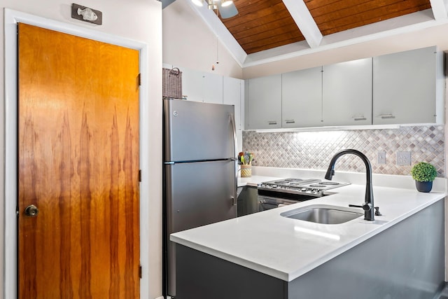 kitchen with wooden ceiling, vaulted ceiling, stainless steel refrigerator, tasteful backsplash, and gray cabinets