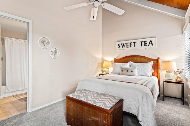 carpeted bedroom with ceiling fan and vaulted ceiling