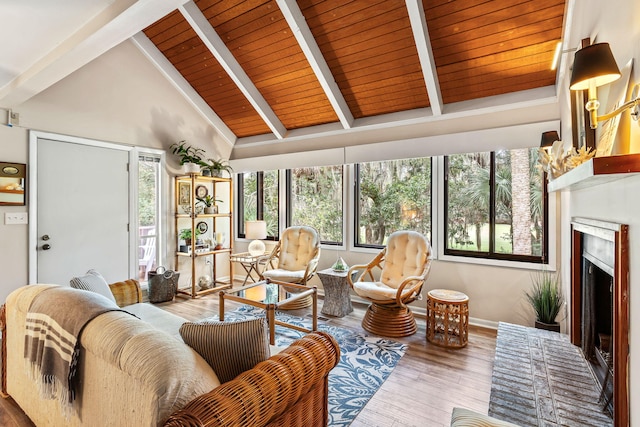 living room featuring wood ceiling, high vaulted ceiling, beamed ceiling, and wood-type flooring