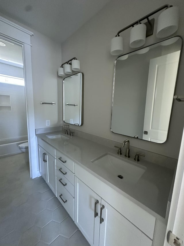 full bathroom with vanity, shower / tub combination, tile patterned floors, and toilet