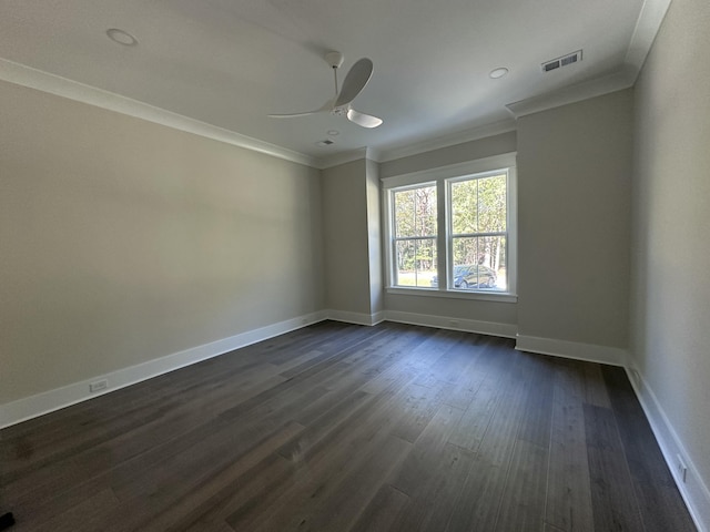 unfurnished room featuring crown molding, dark wood-type flooring, and ceiling fan