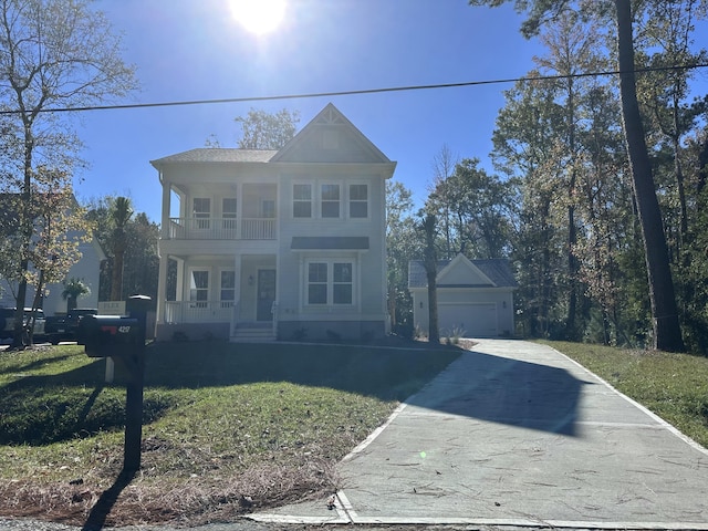 view of front of property with a front yard, a balcony, and a porch